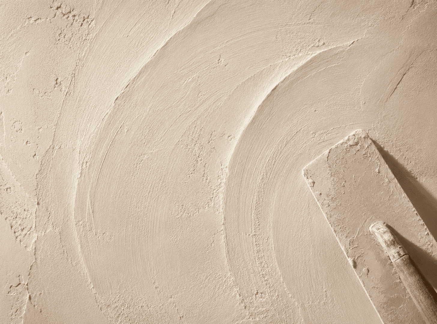 Fine lime plaster texture across a hand-finished surface